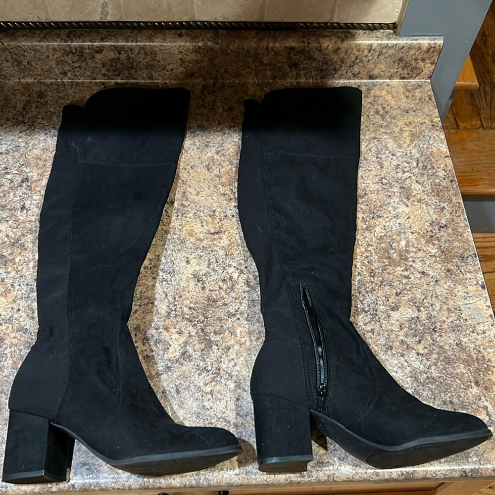 Over the knee boot with give in the shaft and a comfortable 2” heel